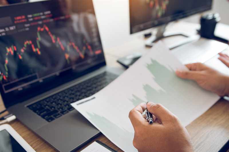 Compliance audit documents being reviewed by a consultant